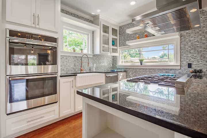 An image of a modern kitchen with sleek appliances, featuring a gas stove, refrigerator, and built-in microwave in Elk River